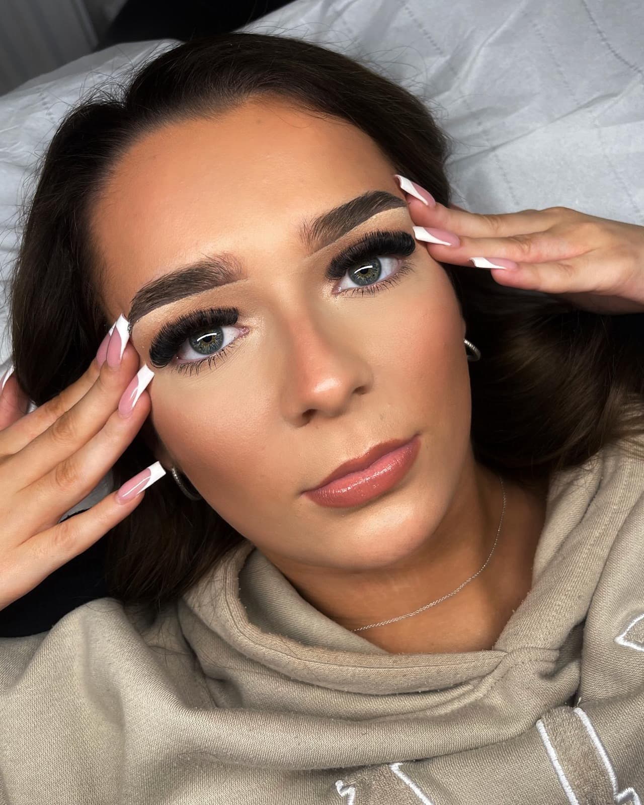 A client with a Russian volume set of eyelash extensions